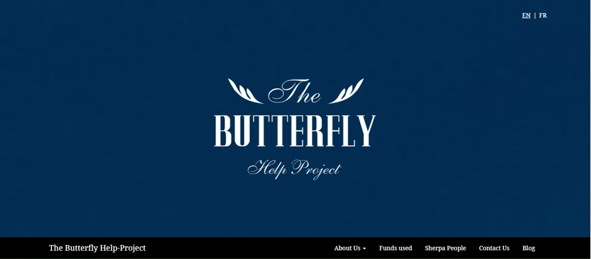 The old site's header: the butterfly logo in white on dark blue, an English and French switch, and a black menu bar.