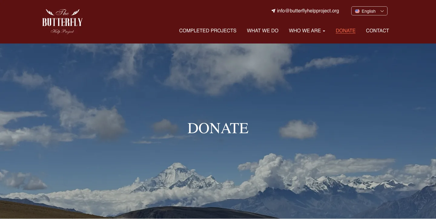 The live donate page: the maroon header with the butterfly logo, the association's email, a language switch and the menu, over Himalayan peaks above the clouds.