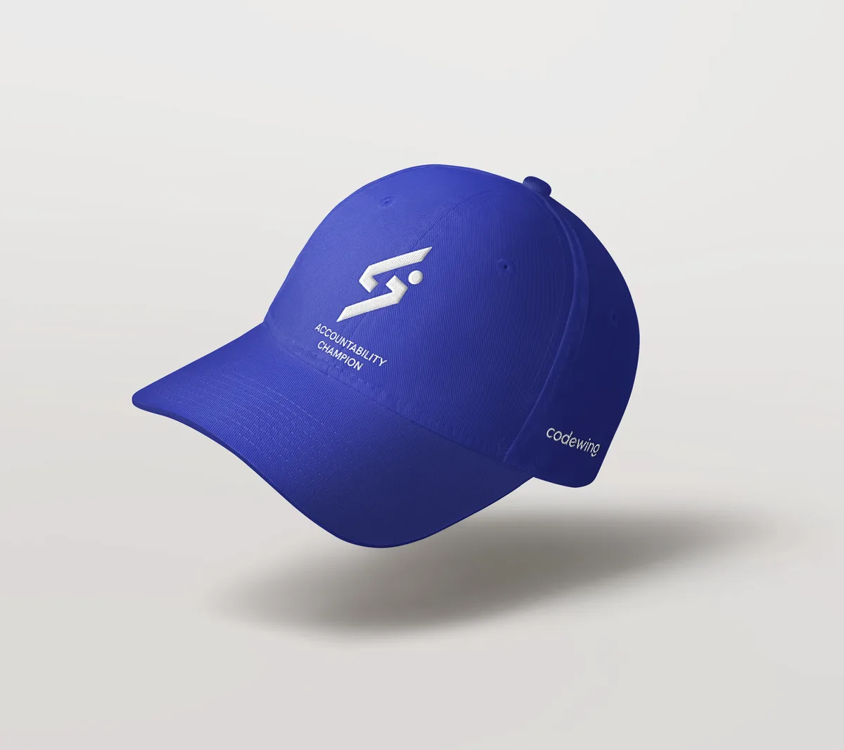 A blue cap with the mark stitched in white on the front and the name on the side.